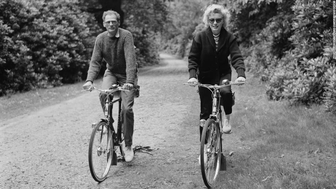 Monroe rides her bike with her third husband Miller. He&#39;s best known for writing the play Death of a Salesman.