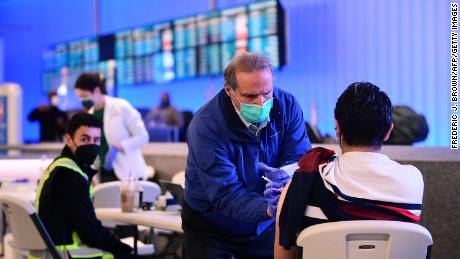Flying home after the holidays? Getting vaccinated or boosted is the first step toward safe travel, expert says