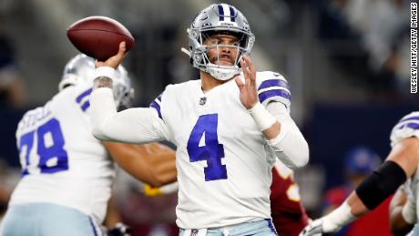 Dak Prescott #4 of the Dallas Cowboys throws a pass during the first half against the Washington Football Team at the AT&amp;T Stadium on December 26, 2021 in Arlington, Texas.