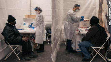 Medical workers prepare COVID-19 tests at a new testing site inside the Times Square subway station on December 27, 2021 in New York City. 