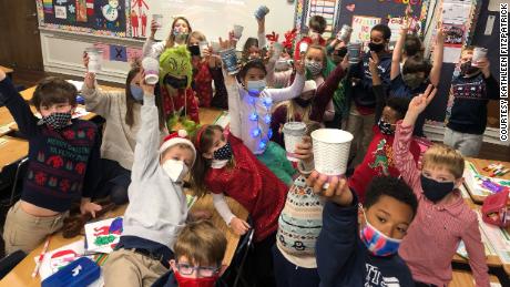 Ms. Fitz's third grade students enjoy their hot chocolate reward.