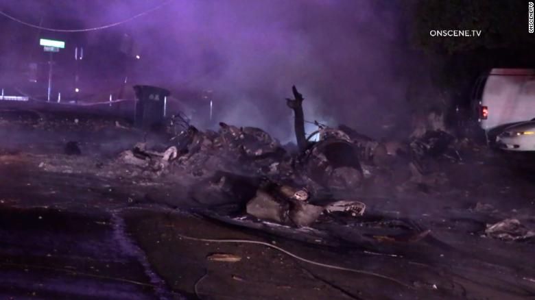 Wreckage of a plane crash covers a street in El Cajon, California.