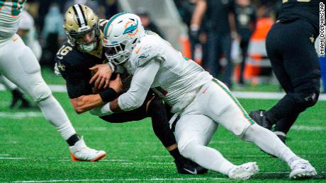 Miami Dolphins defensive end Emmanuel Ogbah (91) sacks New Orleans Saints quarterback Ian Book (16).