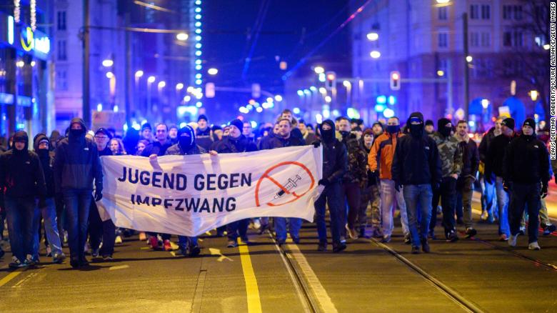 Demonstrators march through the city center of the capital of Saxony-Anhalt with a banner that reads &quot;youth against compulsory vaccination&quot; on Monday.