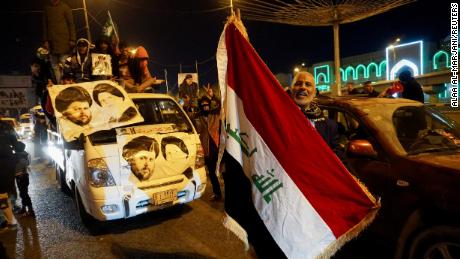 Iraqi supporters of Sadr&#39;s movement celebrate after Iraq&#39;s Supreme Court ratified the results of parliamentary election, in Najaf, Iraq. 