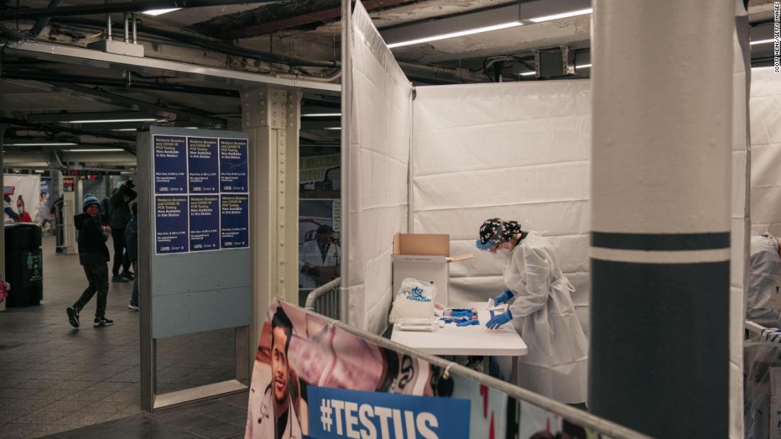 Medical workers in New York prepare Covid-19 tests at a testing site inside the Times Square subway station on December 27.