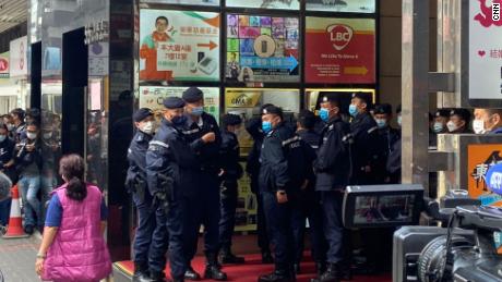 Police officers are on guard during a raid on the Stand News office in Hong Kong.