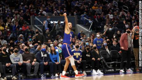 Stephen Curry looks at his 3000th career three-pointer.