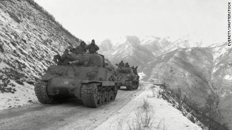 A US M-4A3 Sherman tank convoy travels along the Funchallin Pass in North Korea in 1950.