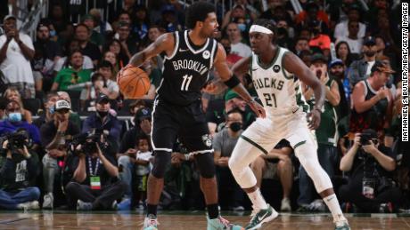 Jrue Holiday #21 of the Milwaukee Bucks plays defense against Kyrie Irving #11 of the Brooklyn Nets during Round 2, Game 4 of the 2021 NBA Playoffs on June 13, 2021 at the Fiserv Forum Center in Milwaukee, Wisconsin.