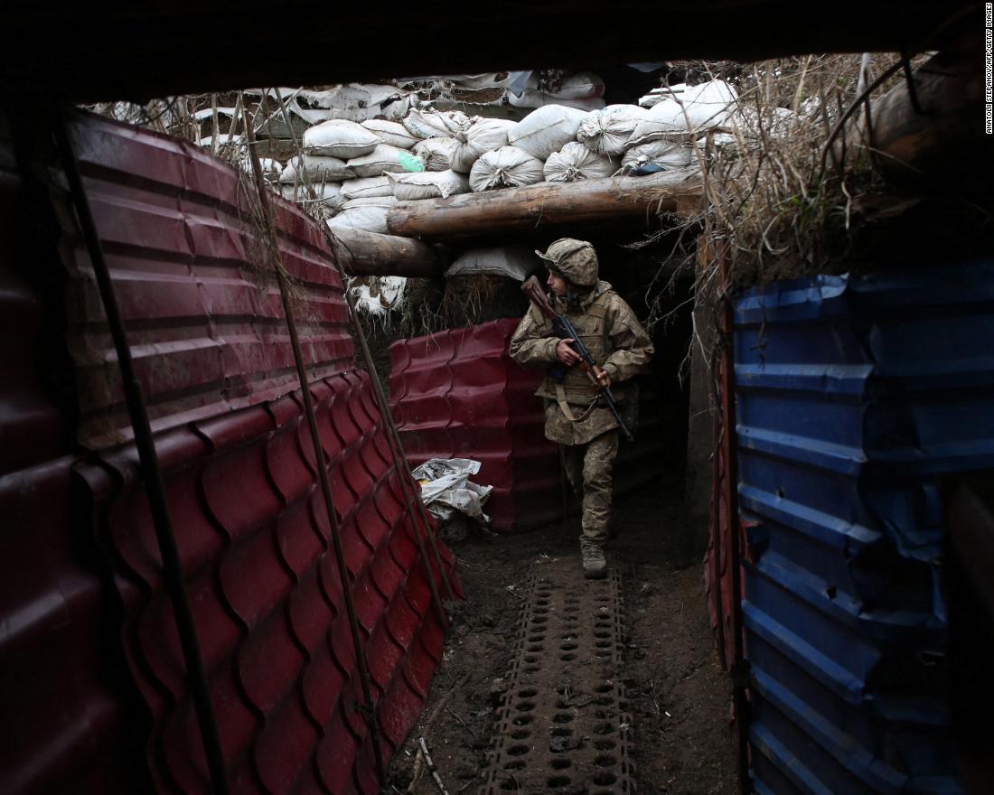 A Ukrainian serviceman walks out of a dugout on the frontline with Russia-backed separatists near the village of Pesky, Donetsk region, on December 14.