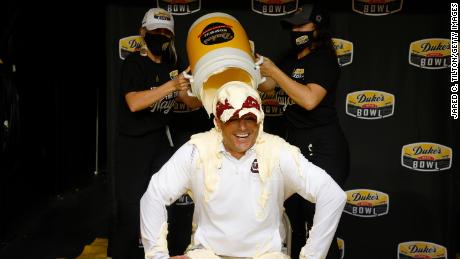 Head coach Shane Beamer of the South Carolina Gamecocks is covered in Duke&#39;s Mayonnaise following his team&#39;s 38-21 victory over the North Carolina Tar Heels. 