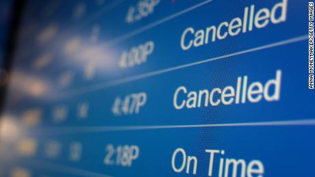 Holiday flight cancellations skyrocket with Covid-19 disruptions and bad weather 