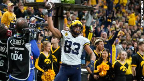 Michigan tight end Erick All (83) celebrates after catching a 5-yard touchdown pass during the second half of the Big Ten championship NCAA  game against Iowa, Saturday, Dec. 4, 2021, in Indianapolis.