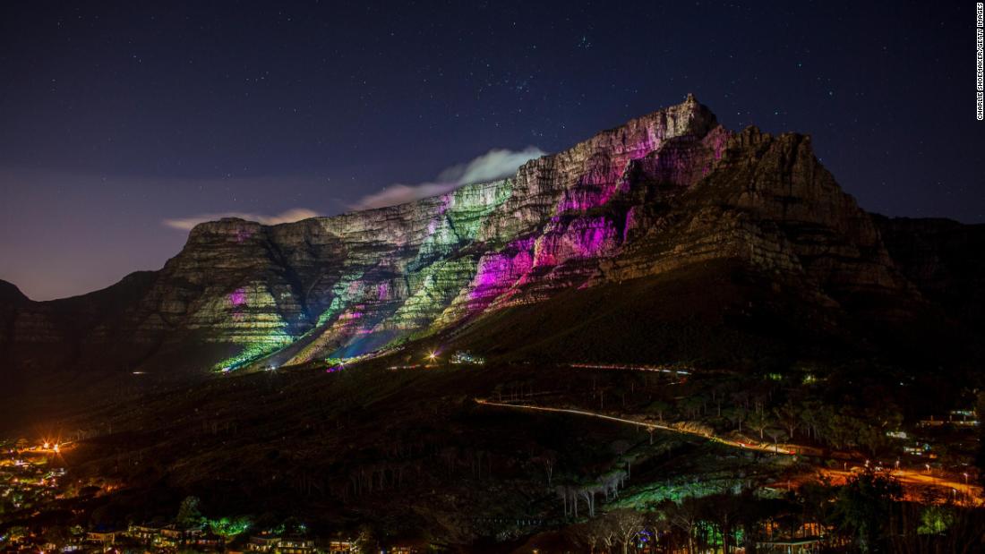 Table Mountain is lit with purple lights to honor the life of archbishop Desmond Tutu on December 30 in Cape Town, South Africa. 