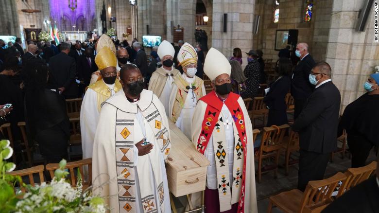 Tutu&#39;s coffin is carried out of St. George&#39;s Cathedral in Cape Town at the end of his funeral service on Saturday. 