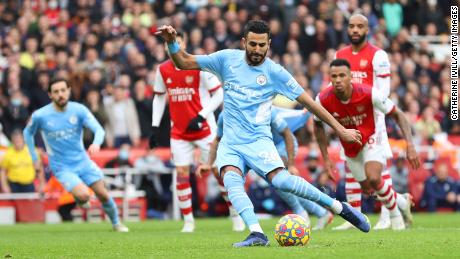 Riyad Mahrez scores Manchester City&#39;s equalizer in the 2-1 win over Arsenal.