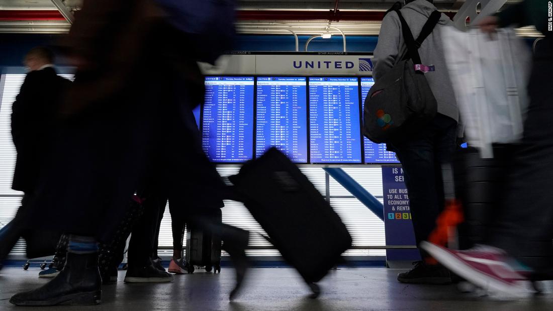 Holiday flight cancellations hit new peak amid Covid, wintry weather 