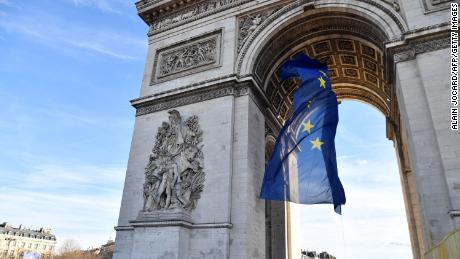 A picture taken on January 1 shows the European Union flag under the Arc de Triomph in Paris.