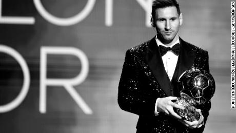 Lionel Messi shows off his seventh Ballon D'Or trophy at the Theatre du Chatelet on November 29, 2021 in Paris, France.