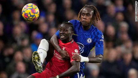 Chelsea&#39;s Trevoh Chalobah, rear, challenges Liverpool&#39;s Sadio Mane during the Premier League  game at Stamford Bridge.