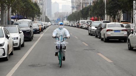 A staff member of a drug store rides a bicycle to deliver medicine in Xi&#39;an, northwest China&#39;s Shaanxi Province, Dec. 31, 2021. Xi&#39;an imposed closed-off management for communities and villages on Dec. 23 in an effort to curb the spread of the latest COVID-19 resurgence. (Photo by Tao Ming/Xinhua via Getty Images)