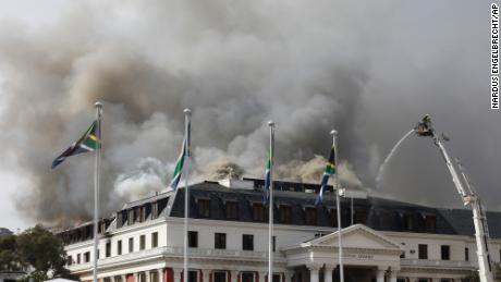 Smoke rises from South Africa's Parliament on Monday after the fire reignited late afternoon.