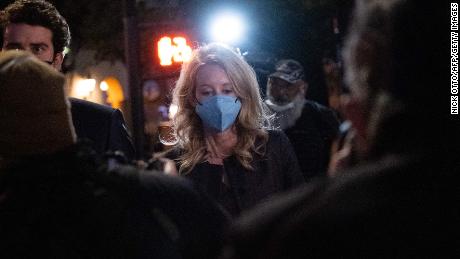 Elizabeth Holmes and partner Billy Evans, walk outside the federal court after she was found guilty on 4 of 11 accounts faced in her fraud trial in San Jose, California, January 3, 2022. 