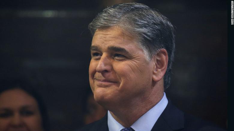 Sean Hannity from Fox News looks on as U.S. President Donald Trump holds a news conference after his summit with North Korean leader Kim Jong Un at the JW Marriott hotel in Hanoi, Vietnam, February 28, 2019. REUTERS/Leah Millis