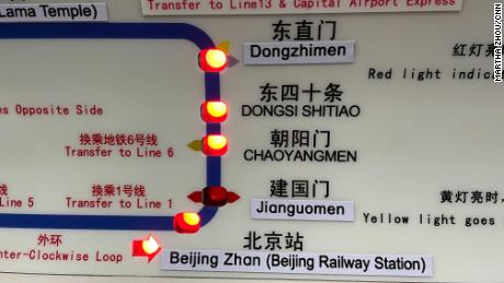 New English names of subway stations have been pasted on a map inside a Beijing subway train.