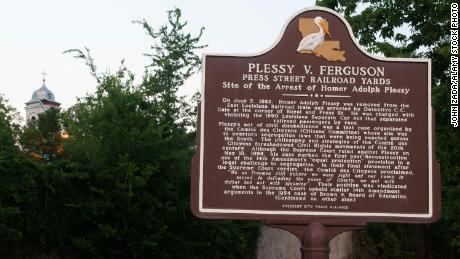A historical sign marking the arrest site of Homer Adolph Plessy in New Orleans, Louisiana. Plessy has received a full pardon from the state.