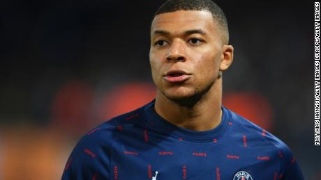 PARIS, FRANCE - OCTOBER 19: Kylian Mbappe of Paris Saint-Germain looks on as he warms up prior to the UEFA Champions League group A match between Paris Saint-Germain and RB Leipzig at Parc des Princes on October 19, 2021 in Paris, France. (Photo by Matthias Hangst/Getty Images)