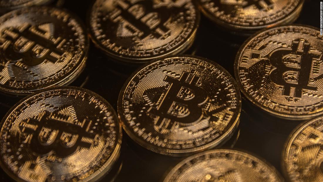 Bitcoin value tumbles almost 50% since record November – CNN