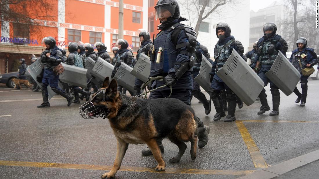 Police move to block demonstrators during a protest in Almaty on January 5.
