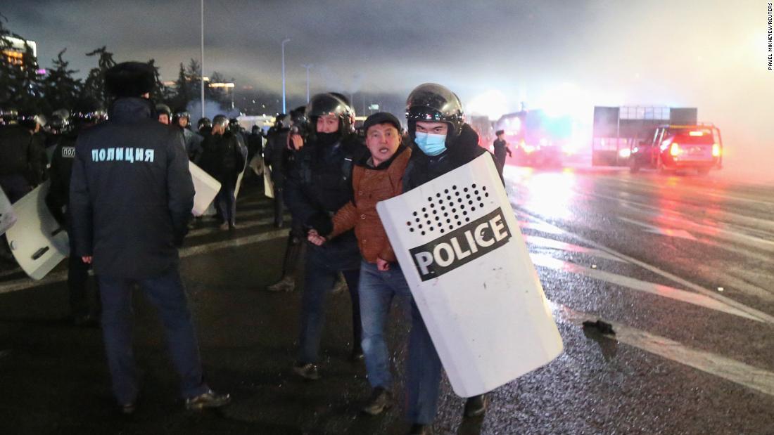 Police detain a man during a protest in Almaty on January 5.