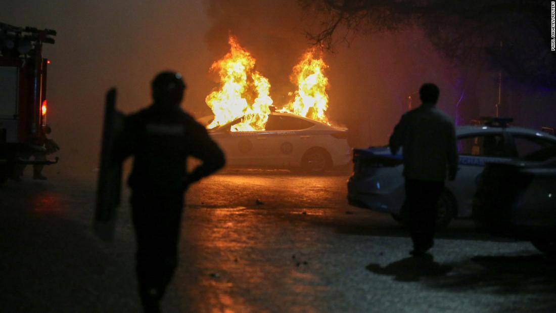 A police car burns during a protest in Almaty on January 5.