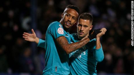 Éder Militão celebrates with Eden Hazard after scoring his team&#39;s first goal against Alcoyano.