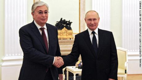 Russia&#39;s President Vladimir Putin greets Kazakhstan&#39;s President Kassym-Jomart Tokayev in Moscow on August 21, 2021. 