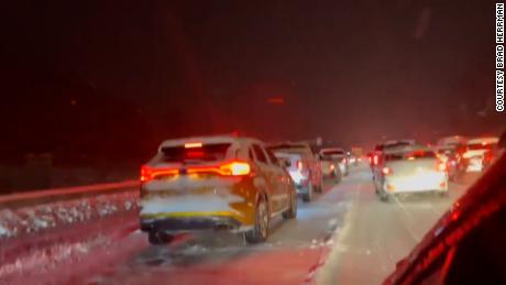 Cars stuck on the interstate as travelers wait for traffic to clear. 