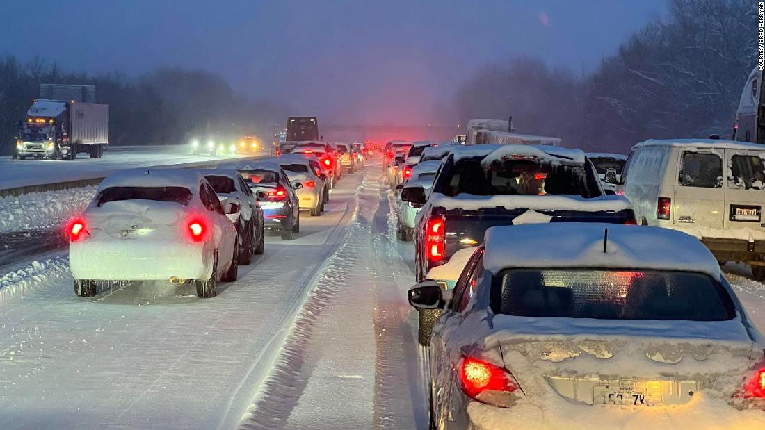 Winter weather in Kentucky halts roadways as authorities work to clear a pile-up with over 20 vehicles