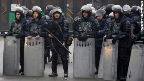 Riot police officers stand by during a protest in Almaty, Kazakhstan, on January 5, 2022.