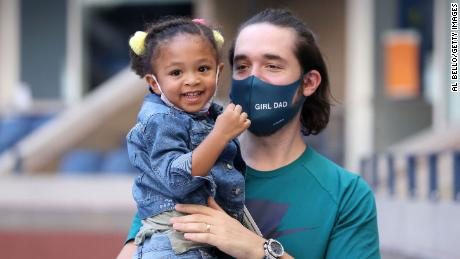 Alexis Ohanian and Alexis Olympia Ohanian Jr., husband and daughter of Serena Williams, attend the US Open women's singles third round match between Serena Williams and Sloane Stephens at the Billie Jean King National Tennis Center in Yosta on September 5, 2020.