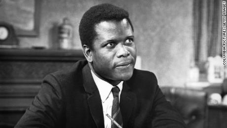 Sidney Poitier sitting with pencil while looking up in a scene from the film &#39;To Sir, With Love&#39;, 1967. (Photo by Columbia Pictures/Getty Images)