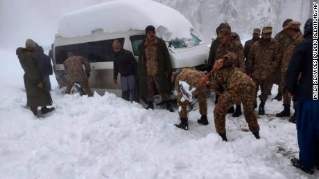 Army troops take part in a rescue operation in Murree.