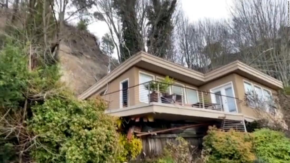 Man rescued after house slides off its foundation in Seattle following heavy rain