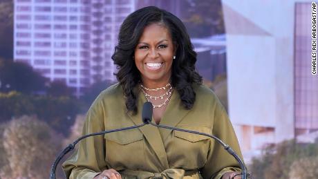 Former first lady Michelle Obama smiles as she speaks during a groundbreaking ceremony for the Obama Presidential Center Tuesday, Sept. 28, 2021, in Chicago. (AP Photo/Charles Rex Arbogast)