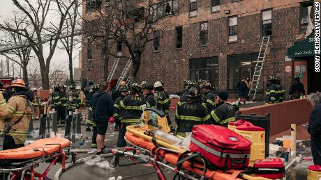 NEW YORK, NY - JANUARY 09: Emergency first responders remain at the scene of an intense fire at a 19-story residential building that erupted in the morning on January 9, 2022 in the Bronx borough of New York City. Reports indicate over 50 people were injured. (Photo by Scott Heins/Getty Images)