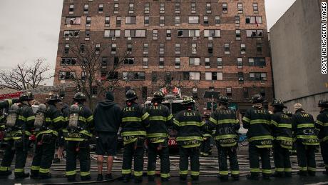NEW YORK, NY - JANUARY 09: Emergency first responders remain at the scene after an intense fire at a 19-story residential building that erupted in the morning on January 9, 2022 in the Bronx borough of New York City. Reports indicate over 50 people were injured. (Photo by Scott Heins/Getty Images)
