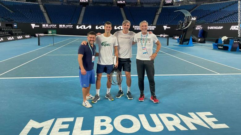 Novak Djokovic posted a photo of himself with his team on the court in Melbourne after being freed from detention. 