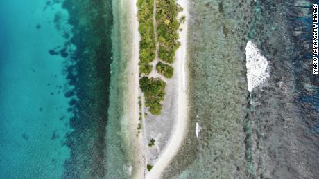 An aerial view of the southern tip of Fongafale island in Tuvalu. The low-lying South Pacific island nation is particularly vulnerable to sea level rise, which is caused in part by warming ocean temperatures. 